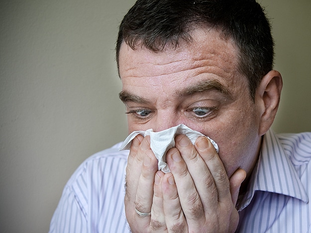 Man Blowing His Nose Tissue