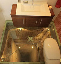 The Glass-Floored Bathroom Built Over 15-Story Elevator Shaft The Glass-Floored Bathroom Built Over 15-Story Elevator Shaft