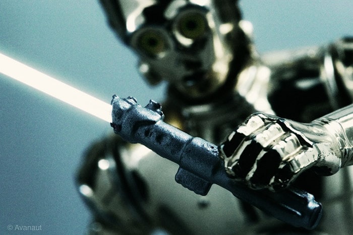 C-3PO Robot Holding Lightsaber