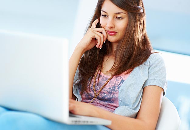 Girl on Laptop Blogging Short Posts vs Long Posts