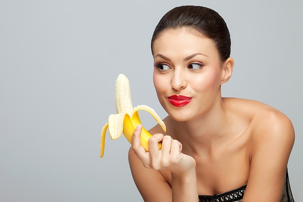 Woman Looking At A Banana Healing Power Of Banana Peels