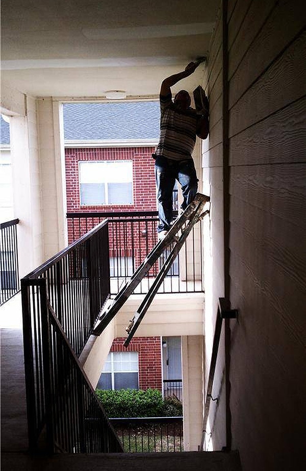 Dangerous Painting Job With Ladder