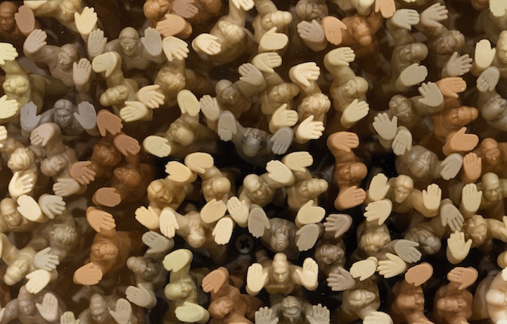 figurines-holding-up-glass-floor figurines-holding-up-glass-floor